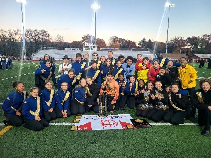  The East Allegheny Marching Band poses with the state championship trophy.